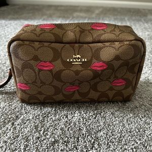 EUC Coach makeup bag with Lips detailing